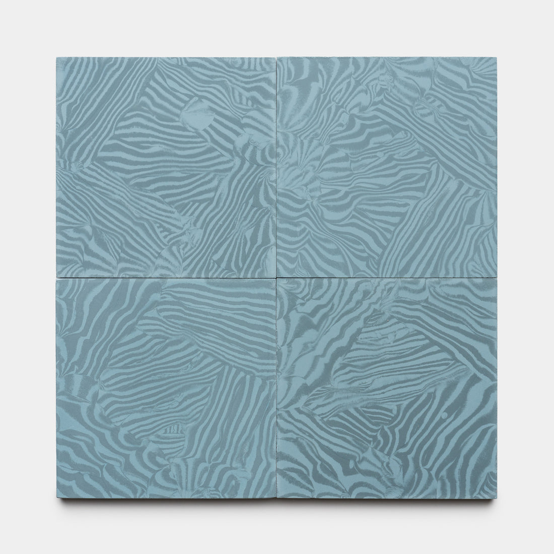 Four Currents Slate + Hyannis 8x8 tiles by Zia Tile arranged in a grid, each showcasing a blue base with lighter blue wavy zebra-like patterns for a textured, abstract look.