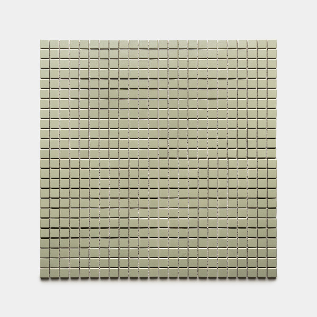 The Zia Tile Cypress 1x1 features a rectangular sheet of small, evenly spaced square beige tiles set on a crisp white background.