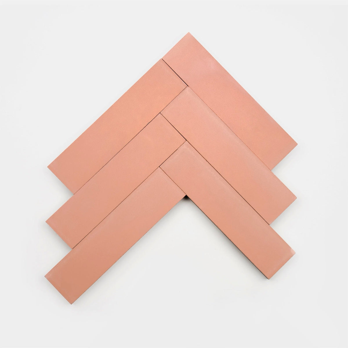 Five rectangular Delta Moon 2x8 tile samples by vendor-unknown are arranged on a white background in a herringbone pattern, forming an upward-pointing arrow shape.