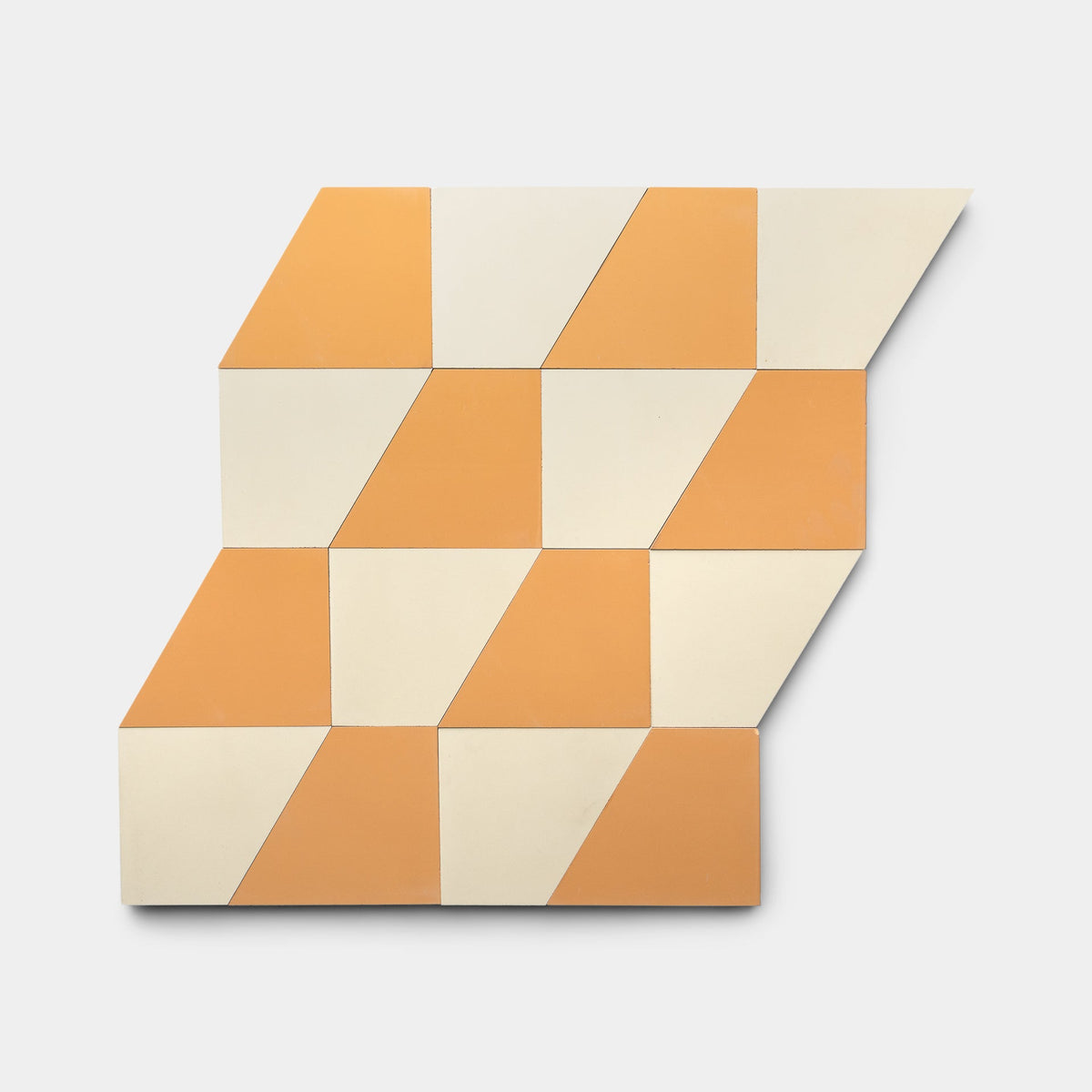 Geometric wall art featuring Derby Ginger + Bone handmade tiles by Zia Tile, arranged in cream and orange diamond shapes in an angled zigzag pattern on a white background.
