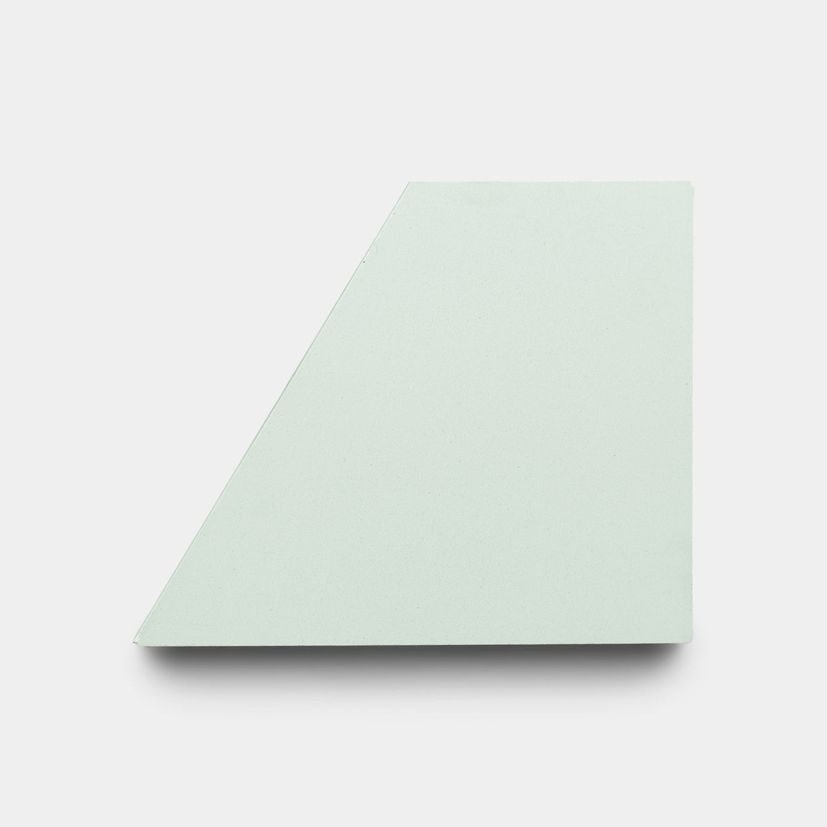 Derby Julep + Noble Green, Sample by Zia Tile: a flat, light green four-sided geometric tile shape with one short edge, shown against a plain white background.