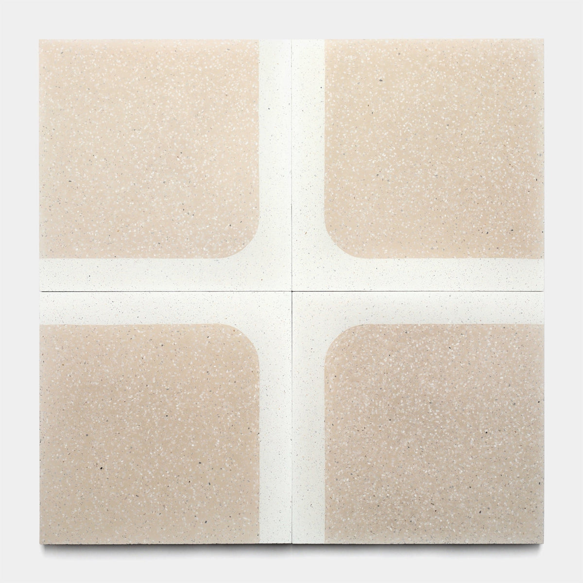 The Draper Dune 12x12 Sample by Zia Tile is a square tile with four speckled beige sections divided by wide white lines that cross in the center, forming a minimalist pattern with rounded corners.