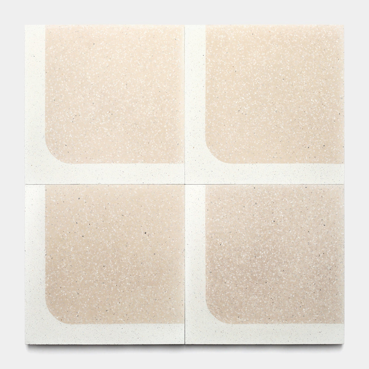 Four Zia Tile Draper Dune 12x12 tiles (Sample) are arranged in a grid, each featuring a beige speckled center with one rounded corner and a white border, creating a symmetrical pattern with rounded corners facing inward.