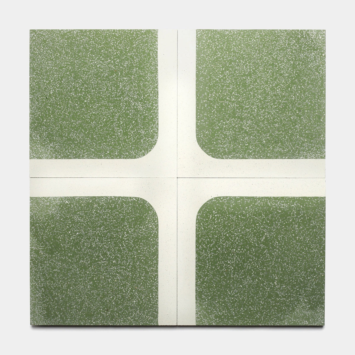 The Zia Tile Draper Saguaro 12x12 Sample is a square tile with a green speckled background and white lines forming a rounded cross that divides the surface into four sections.
