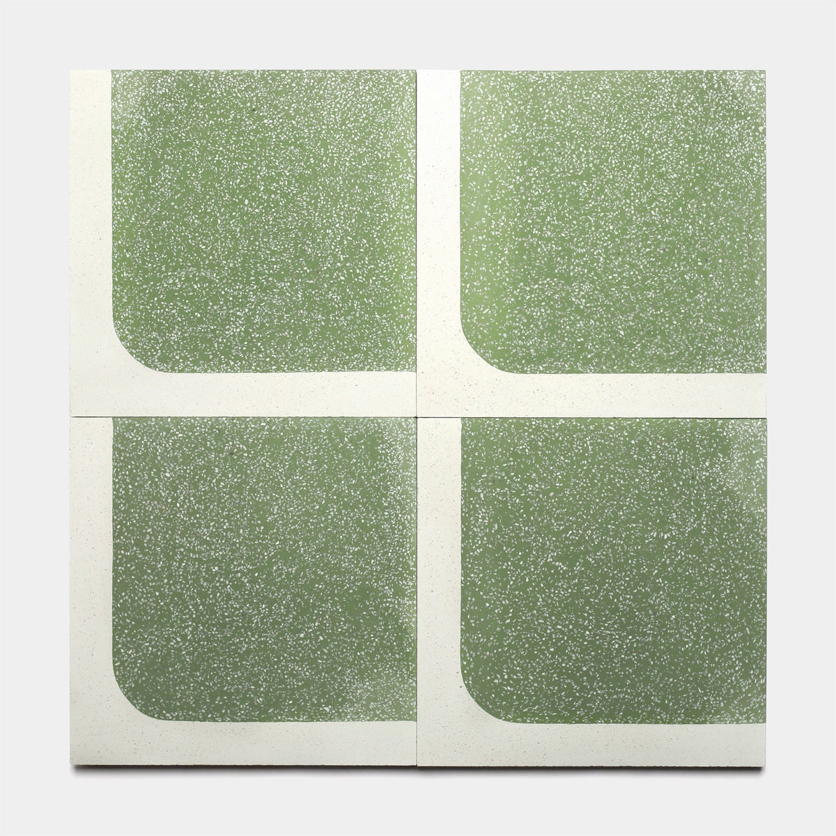 Four 12x12 square tiles from Zia Tile's Draper Saguaro collection, each with green speckled sections and rounded white borders forming a central cross—shown as samples on a plain gray background.