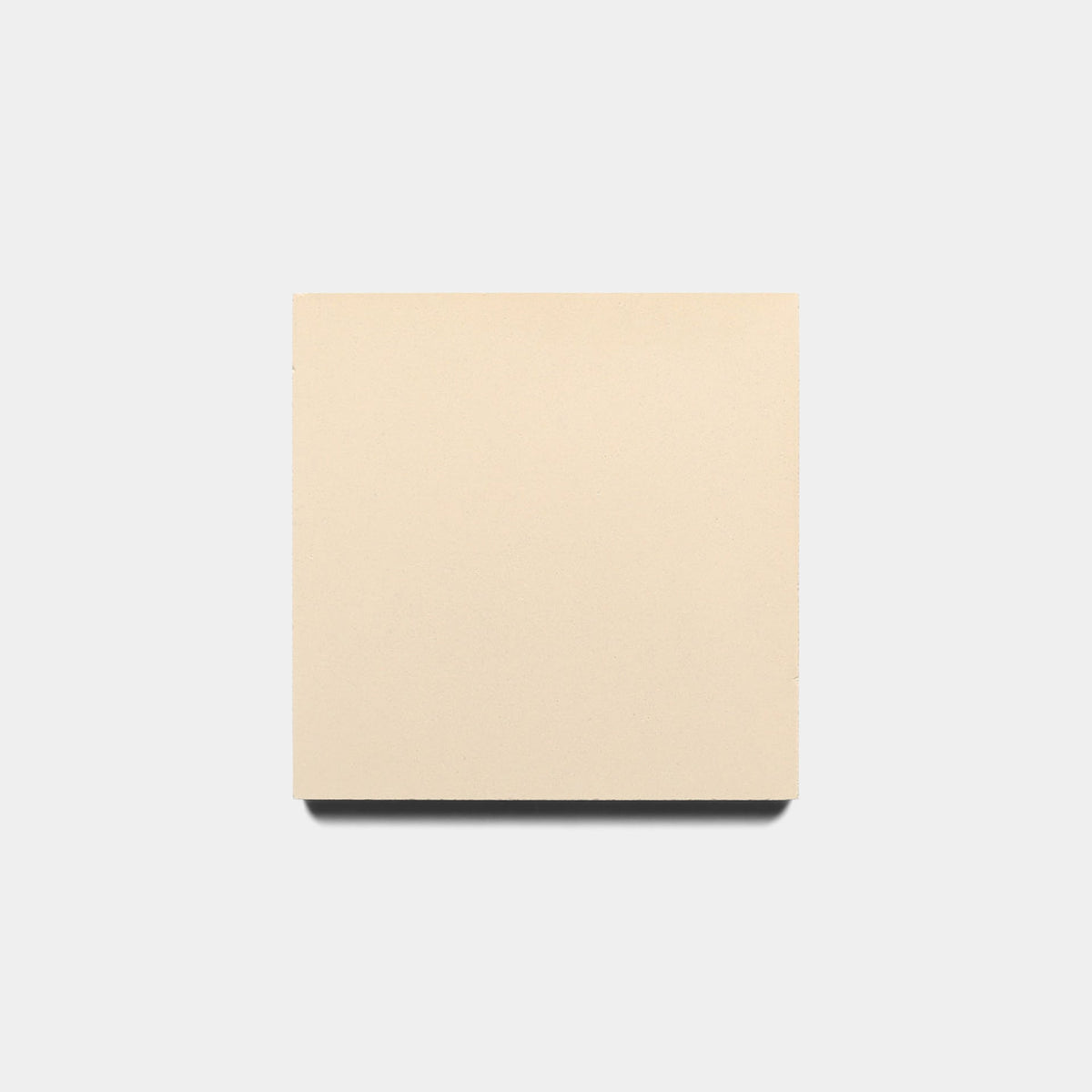 A plain, square Dune 4x4 Sample by Zia Tile in beige is centered on a light gray background, casting a subtle shadow below.
