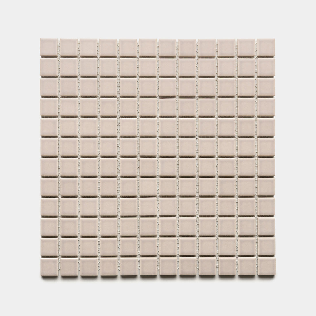 A square sheet of Zia Tile’s Earl Grey 1x1 small, light beige ceramic tiles, evenly spaced in a grid pattern, shown against a white background.