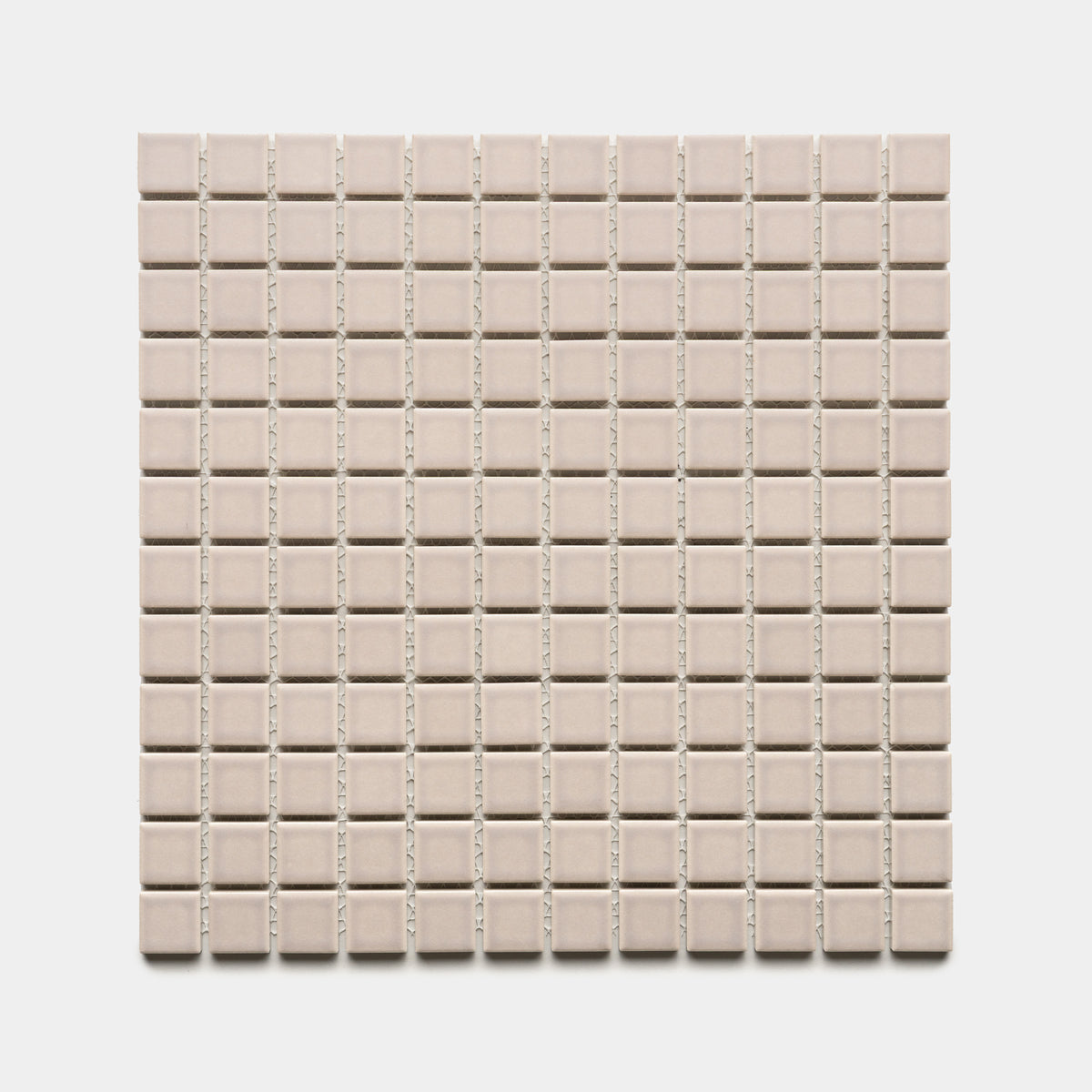 A square sheet of Zia Tile’s Earl Grey 1x1 small, light beige ceramic tiles, evenly spaced in a grid pattern, shown against a white background.
