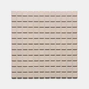 A square sheet of Zia Tile’s Earl Grey 1x1 small, light beige ceramic tiles, evenly spaced in a grid pattern, shown against a white background.