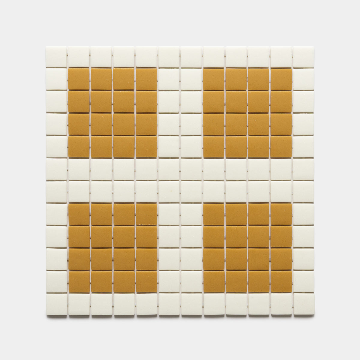The Ells Milk + Rye sample by Zia Tile features a grid of small white square tiles with four larger orange squares, evenly spaced in a 2x2 pattern.