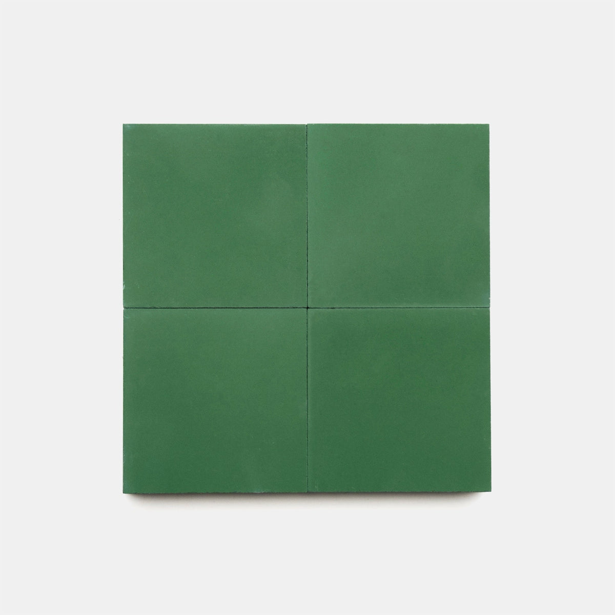 Four vendor-unknown Emerald 4x4 tile samples are arranged in a 2x2 grid on a plain white background.