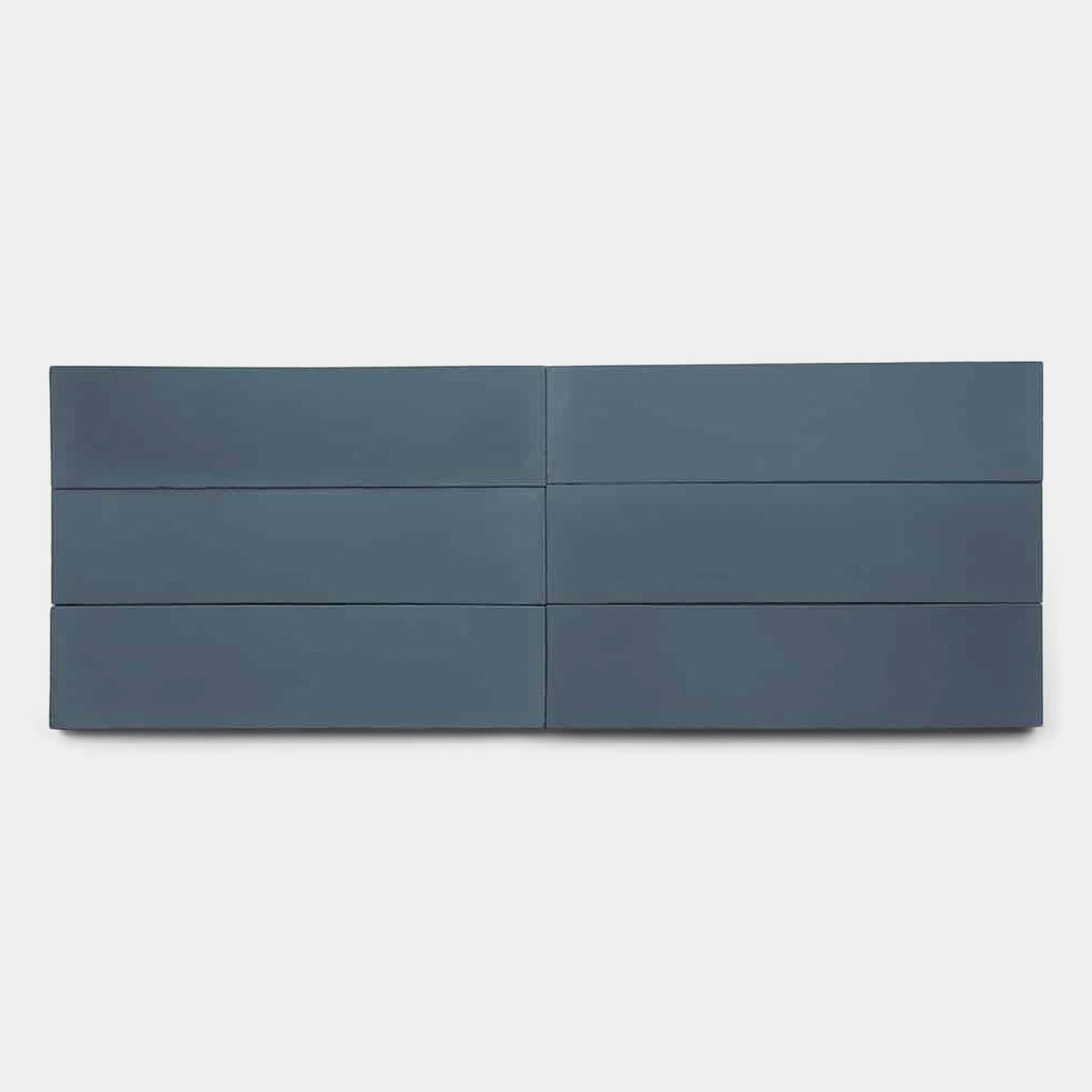 A minimalist artwork displays six Zia Tile Elemental Blue 2x8 Sample panels in two rows of three, set against a white background. The evenly spaced, horizontally aligned tiles highlight their sleek design.