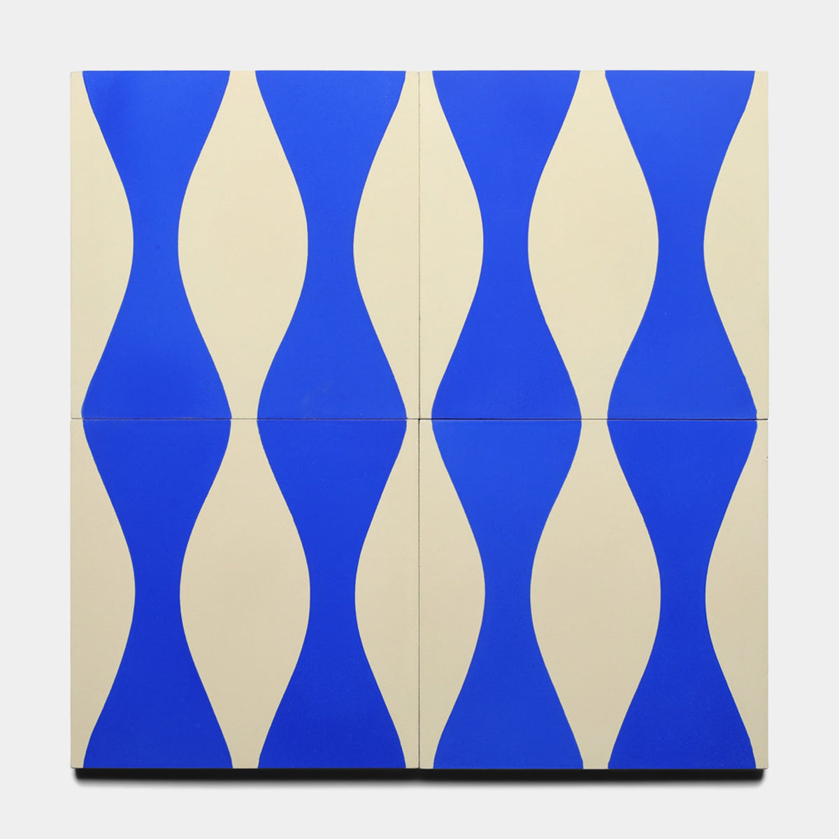 Four Enzo Elemental Blue 8x8 tiles by Zia Tile arranged in a grid showcase bold wavy blue and cream patterns, creating a striking, repetitive design—perfect as an eye-catching sample.