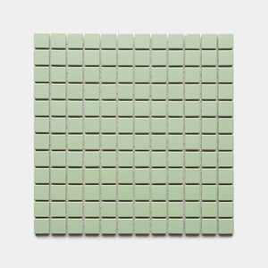 Eucalyptus 1x1 by Zia Tile features small, square, light green tiles arranged in an even grid across a white background.