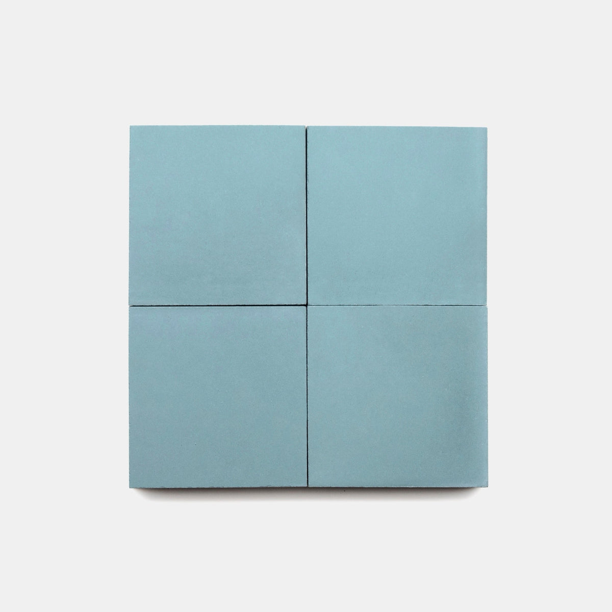 Four Everest 4x4 light blue cement tiles by vendor-unknown, arranged in a 2x2 grid on a white background.