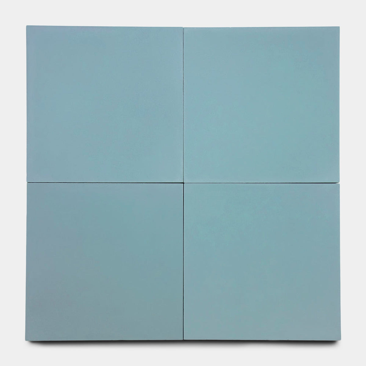Four light blue square panels from the Zia Tile Rust 8x8, Sample are arranged in a grid to form a larger square with visible seams, set against a plain white background.