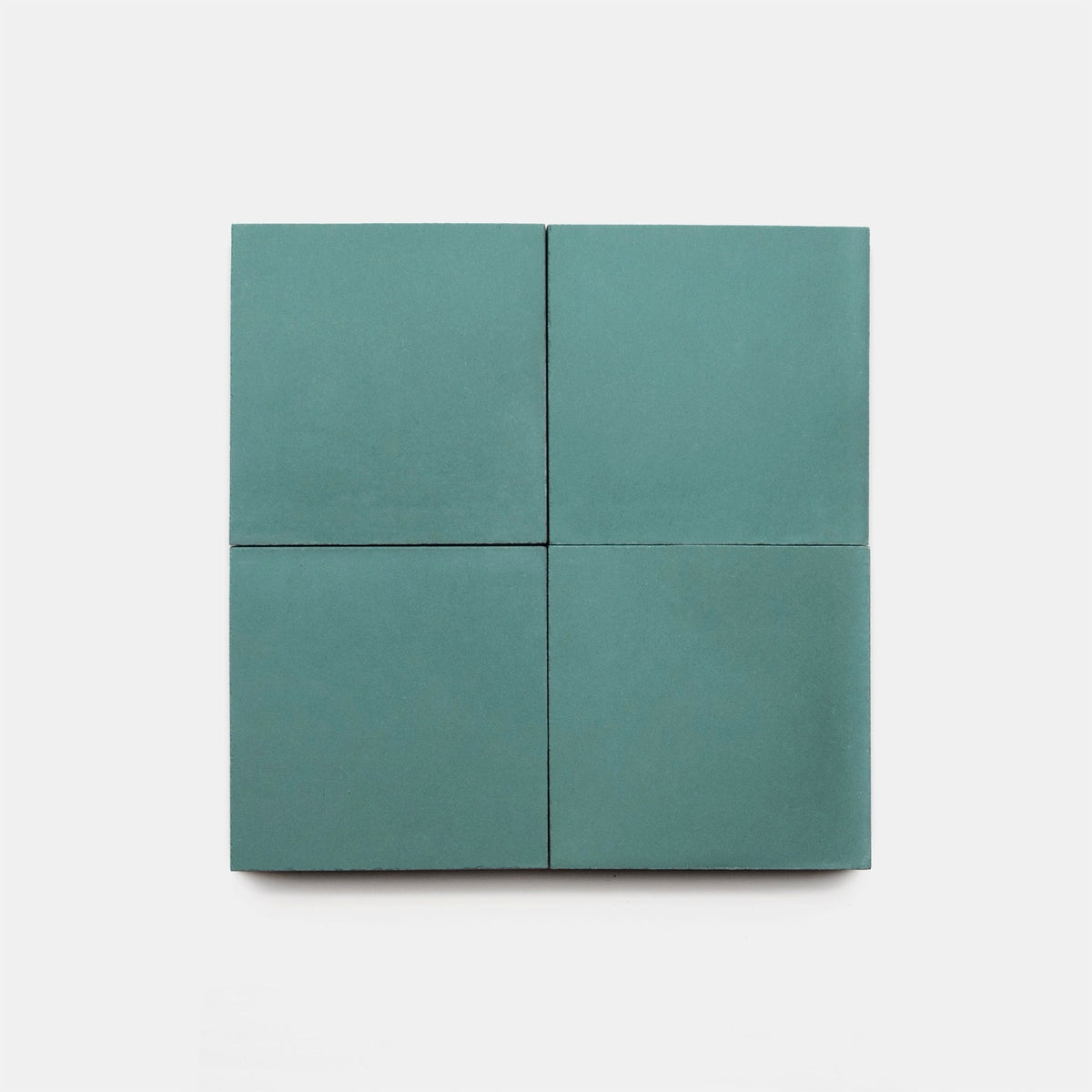 Four Everglade 4x4 matte teal square cement tiles by vendor-unknown are arranged in a 2x2 grid on a plain white background.