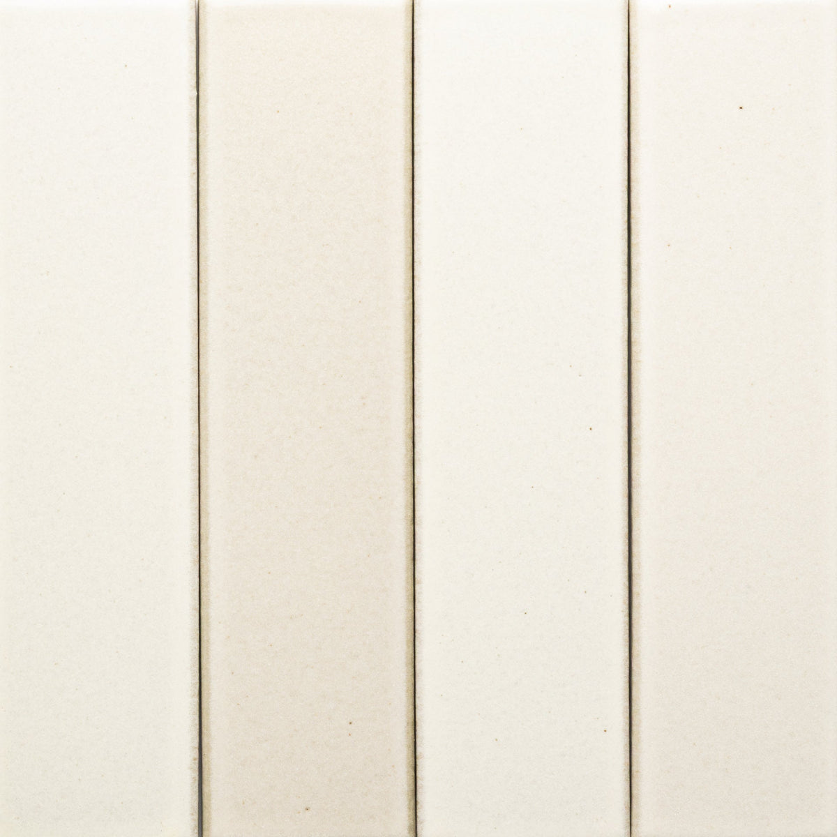 Close-up of four Feather + Flat, Sample tiles by Zia Tile in off-white and beige shades, aligned vertically with visible grout lines. The smooth surface has a slightly glossy finish.