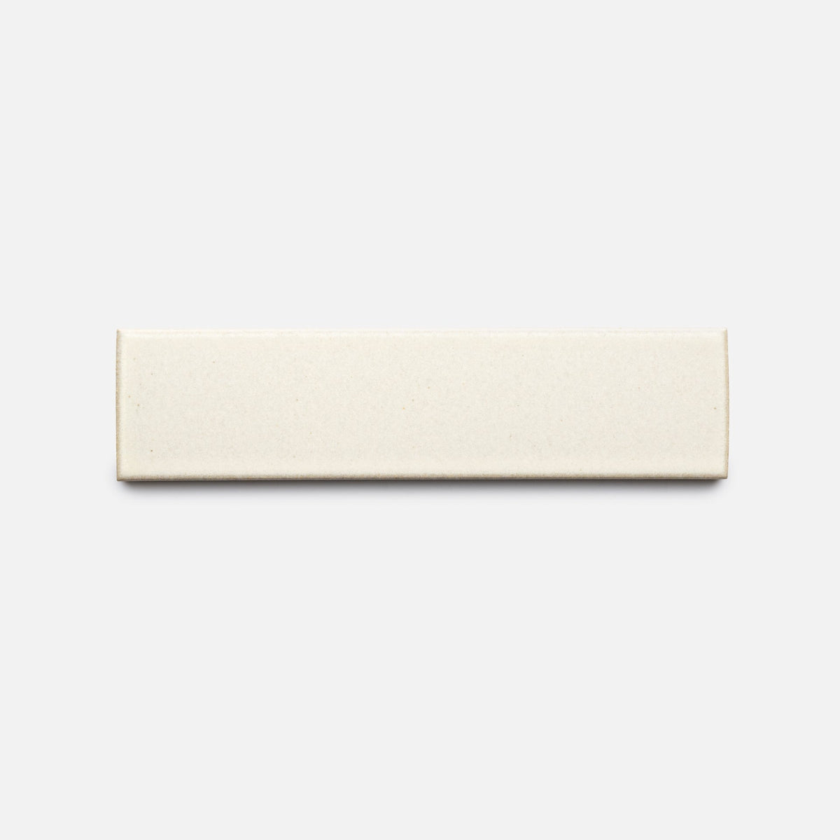 The Feather + Flat, Sample by Zia Tile is a rectangular off-white ceramic tile with smooth edges, shown against a plain light gray background.