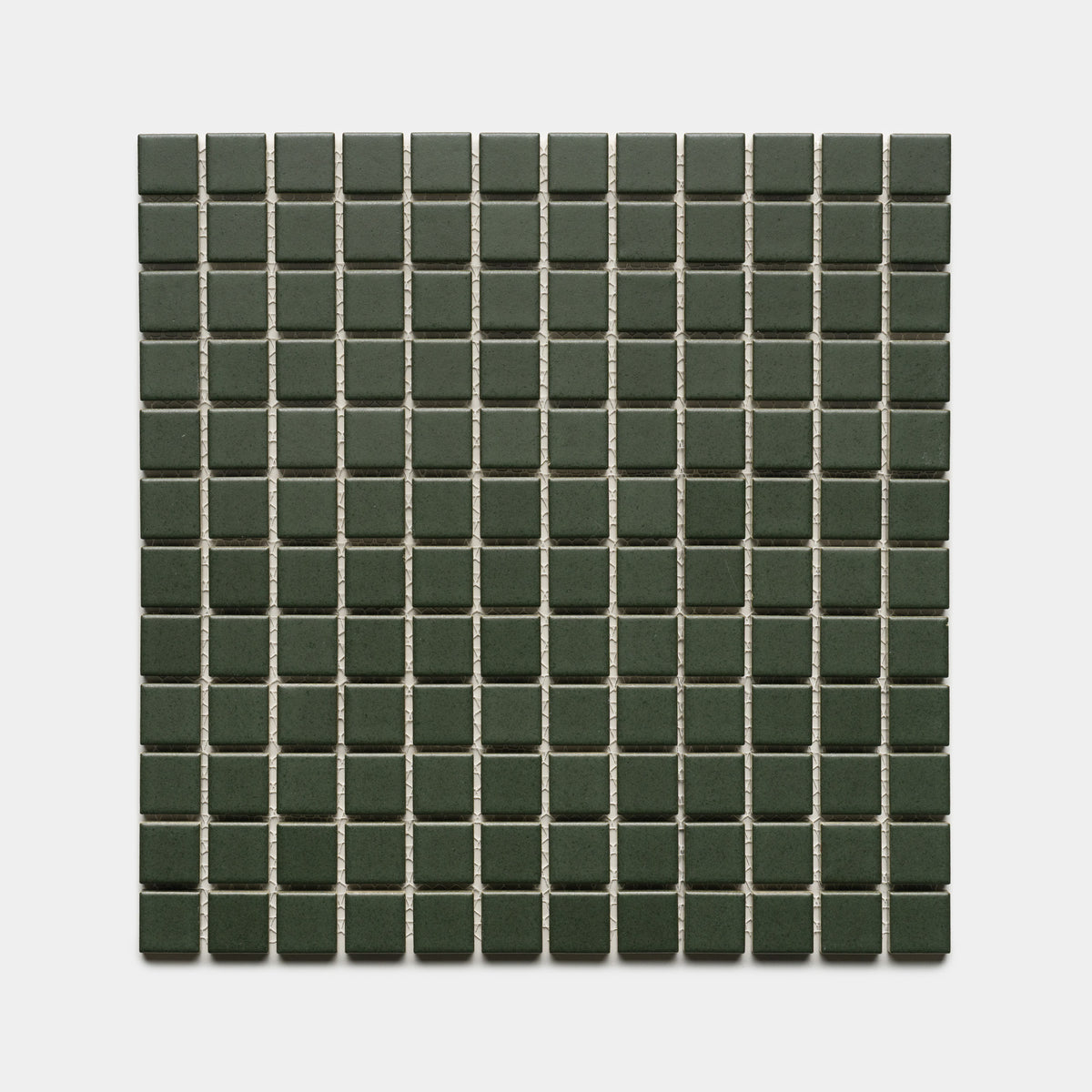 Fraser 1x1 by Zia Tile features small, square dark green tiles with light grout lines, creating a neat and symmetrical pattern on a white background.
