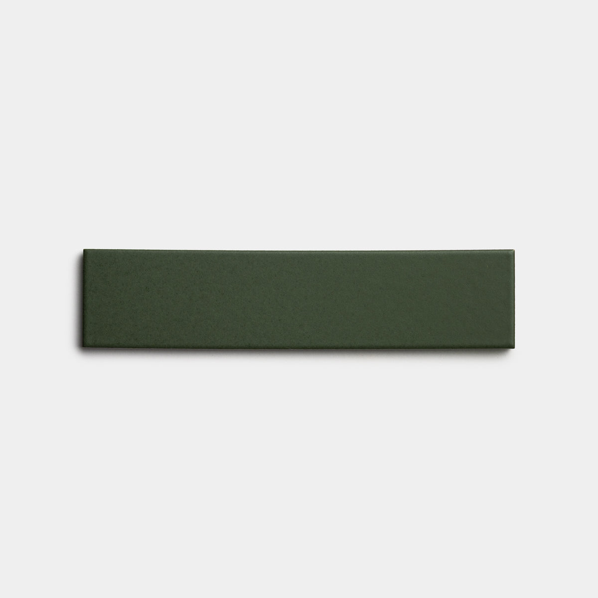 A single Fraser 2x8 rectangular, dark green ceramic tile by Zia Tile displayed on a plain white background.
