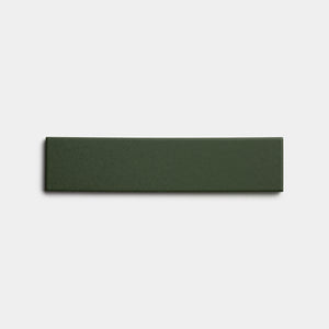 A single Fraser 2x8 rectangular, dark green ceramic tile by Zia Tile displayed on a plain white background.