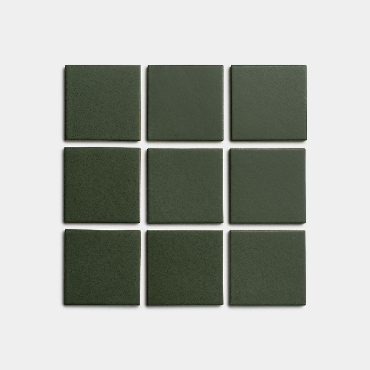 Nine Fraser 4x4 dark green square tiles by Zia Tile are arranged in a three-by-three grid on a plain white background.