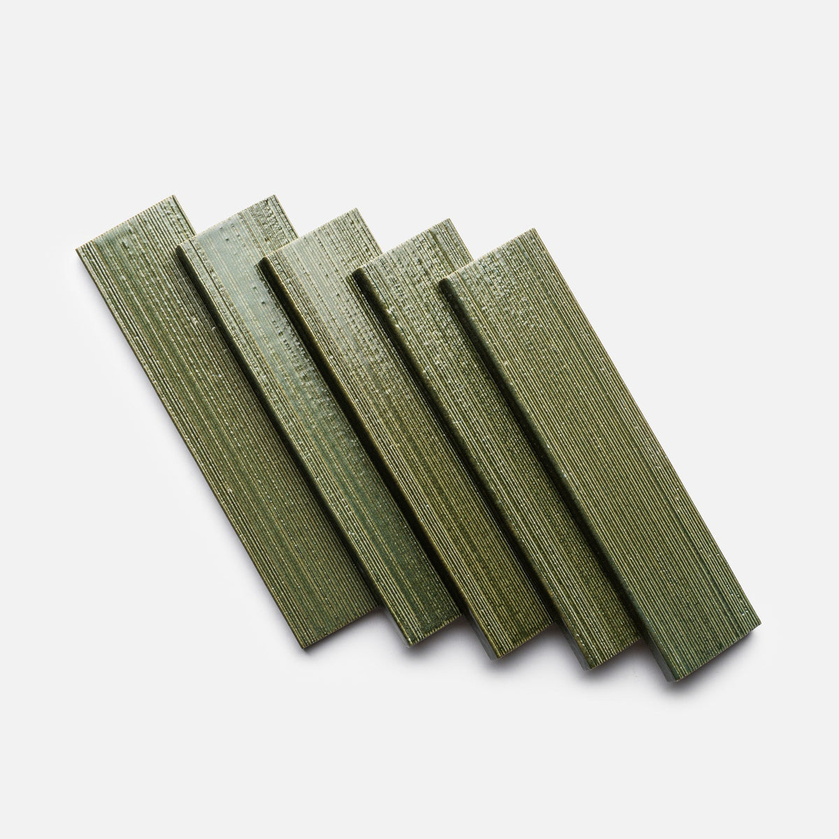 Five rectangular Frogtown + Etched, Sample tiles by Zia Tile, in green with a textured finish, are arranged side by side on a white background and angled slightly to the right.