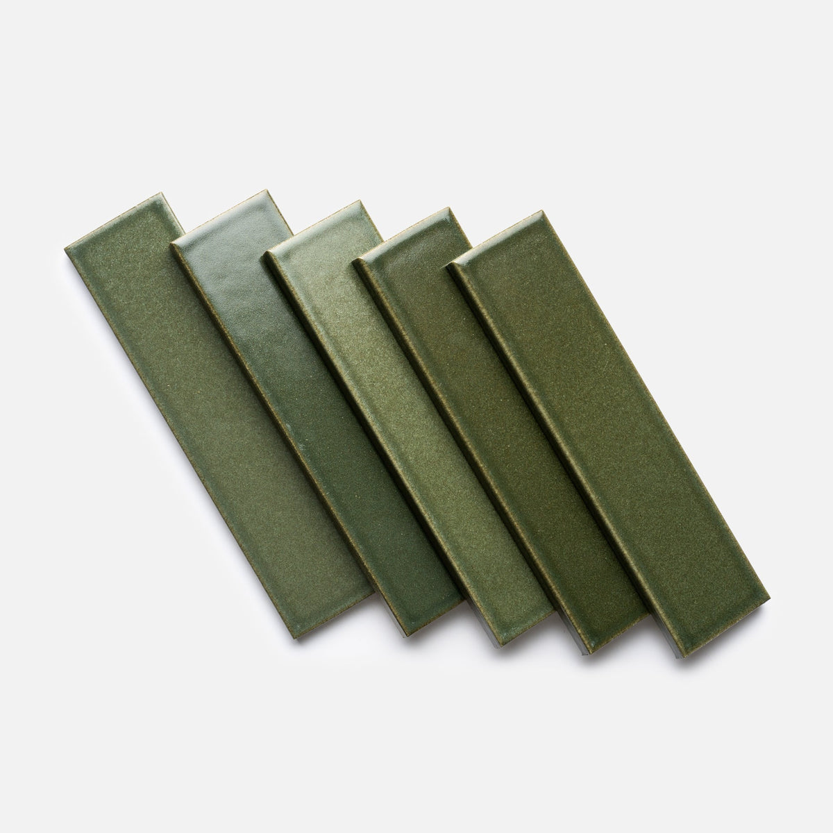 Five green, rectangular Frogtown + Flat ceramic tile samples by Zia Tile are arranged in a slightly overlapping, diagonal pattern on a white background.