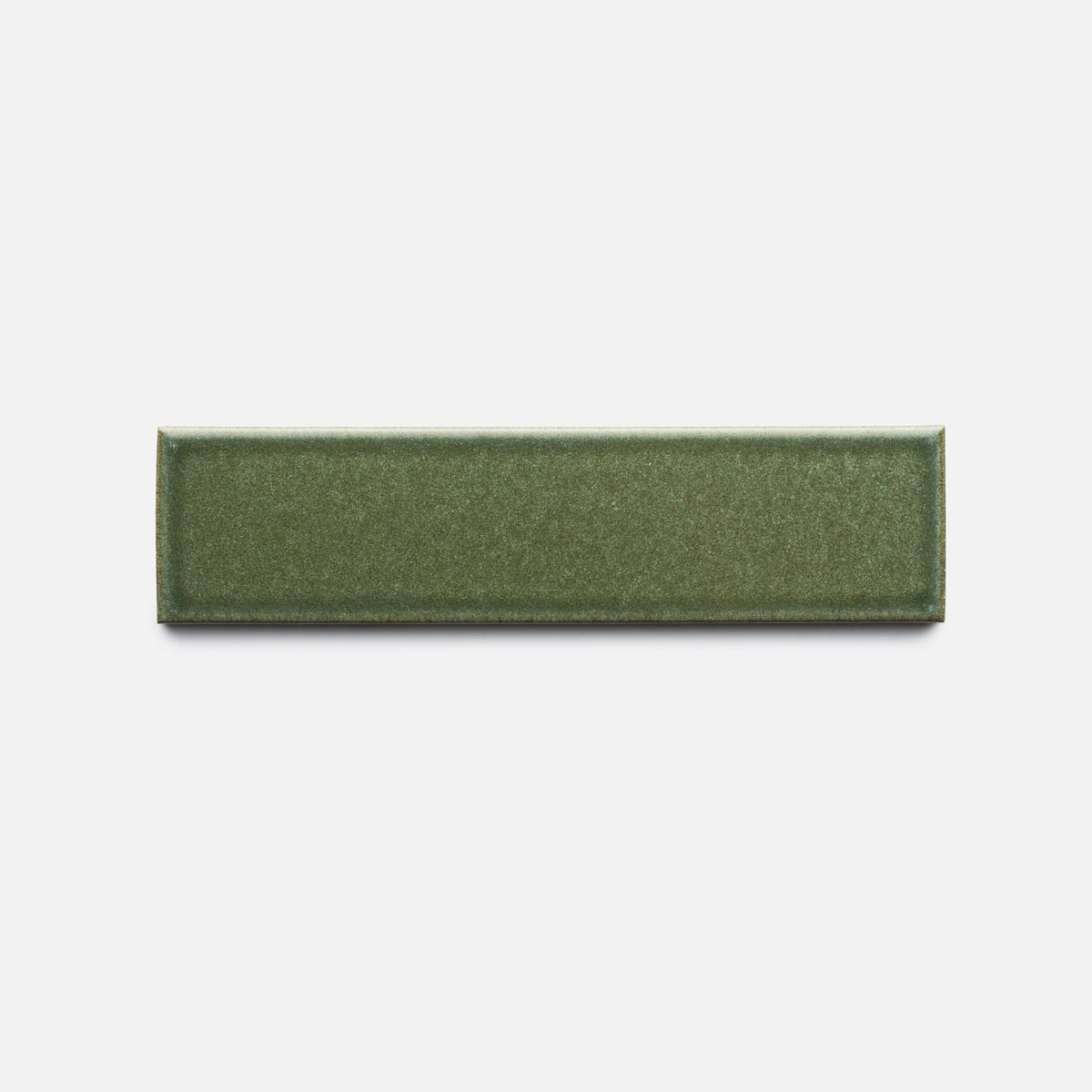 A Frogtown + Flat, Sample from Zia Tile—a rectangular, glossy olive green ceramic tile—is centered on a plain white background.
