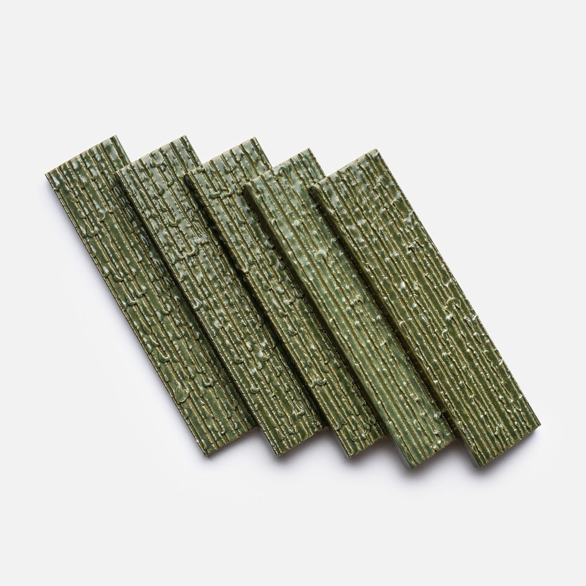 Five green, rectangular Zia Tile “Frogtown + Furrowed, Sample” tiles with a ridged texture are neatly arranged in an overlapping diagonal pattern on a plain white background.