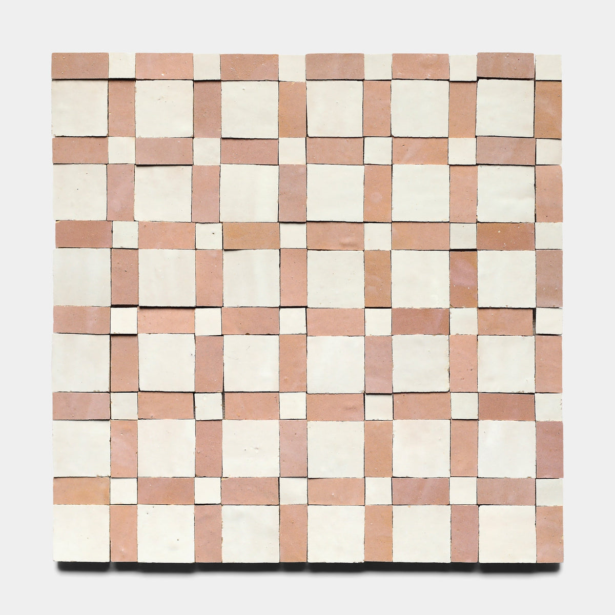 The Gambit 3, Sample from Zia Tile is a square mosaic featuring a geometric checkerboard pattern with alternating light beige and muted pink handmade tiles in an orderly grid.