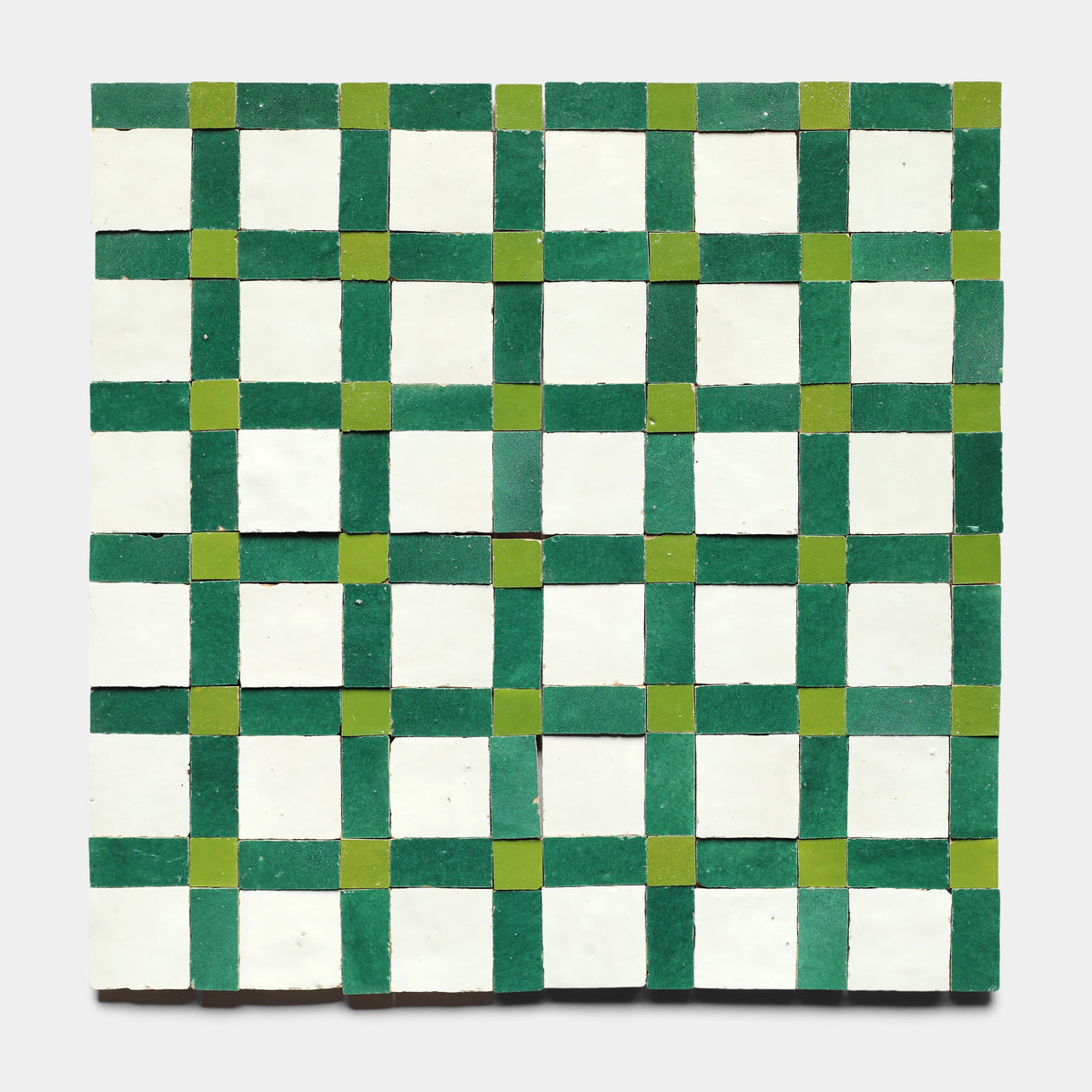 The Gambit 6, Sample by Zia Tile features a square grid pattern with alternating green, light green, and white squares for a handmade checkerboard look and a textured, slightly uneven surface.