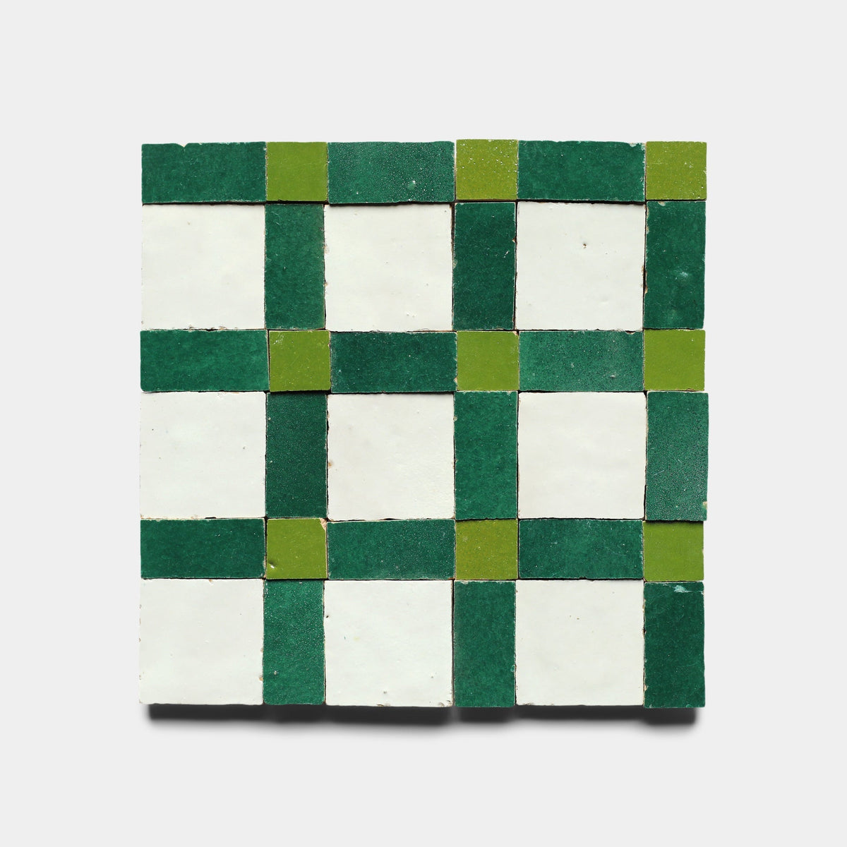 The Gambit 6 sample by Zia Tile displays a checkerboard grid of dark green, light green, and white squares on a plain white background.