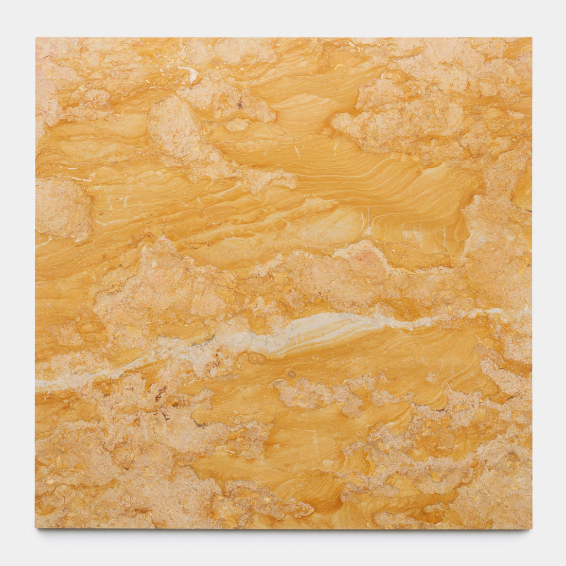 The Giallo Reale 24x24 by Zia Tile is a square yellow-orange marble slab with wavy, layered patterns and irregular veins in lighter and darker shades, shown against a plain white background.