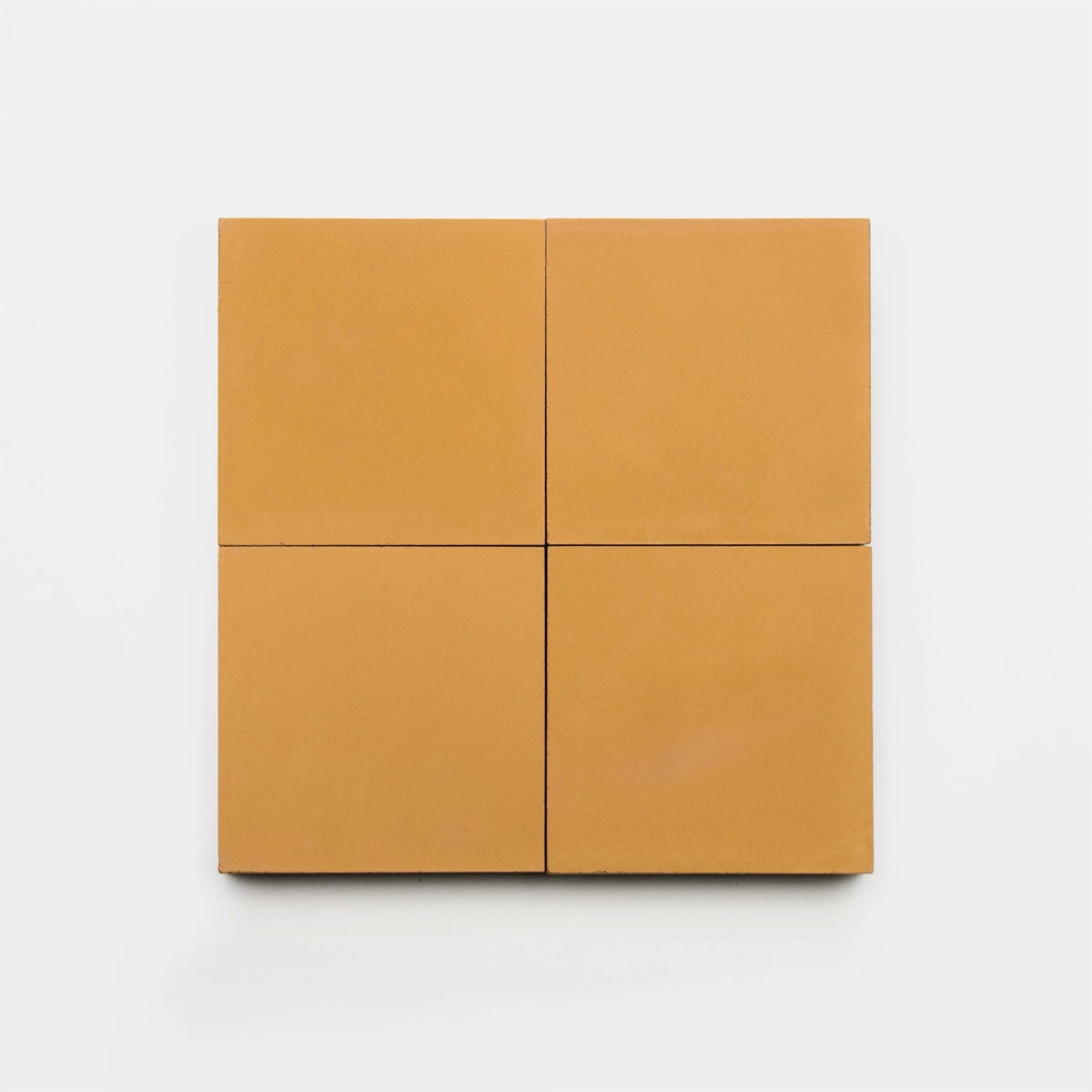 Four square, matte Ginger 4x4 tiles by vendor-unknown are arranged in a larger square on a plain white background.