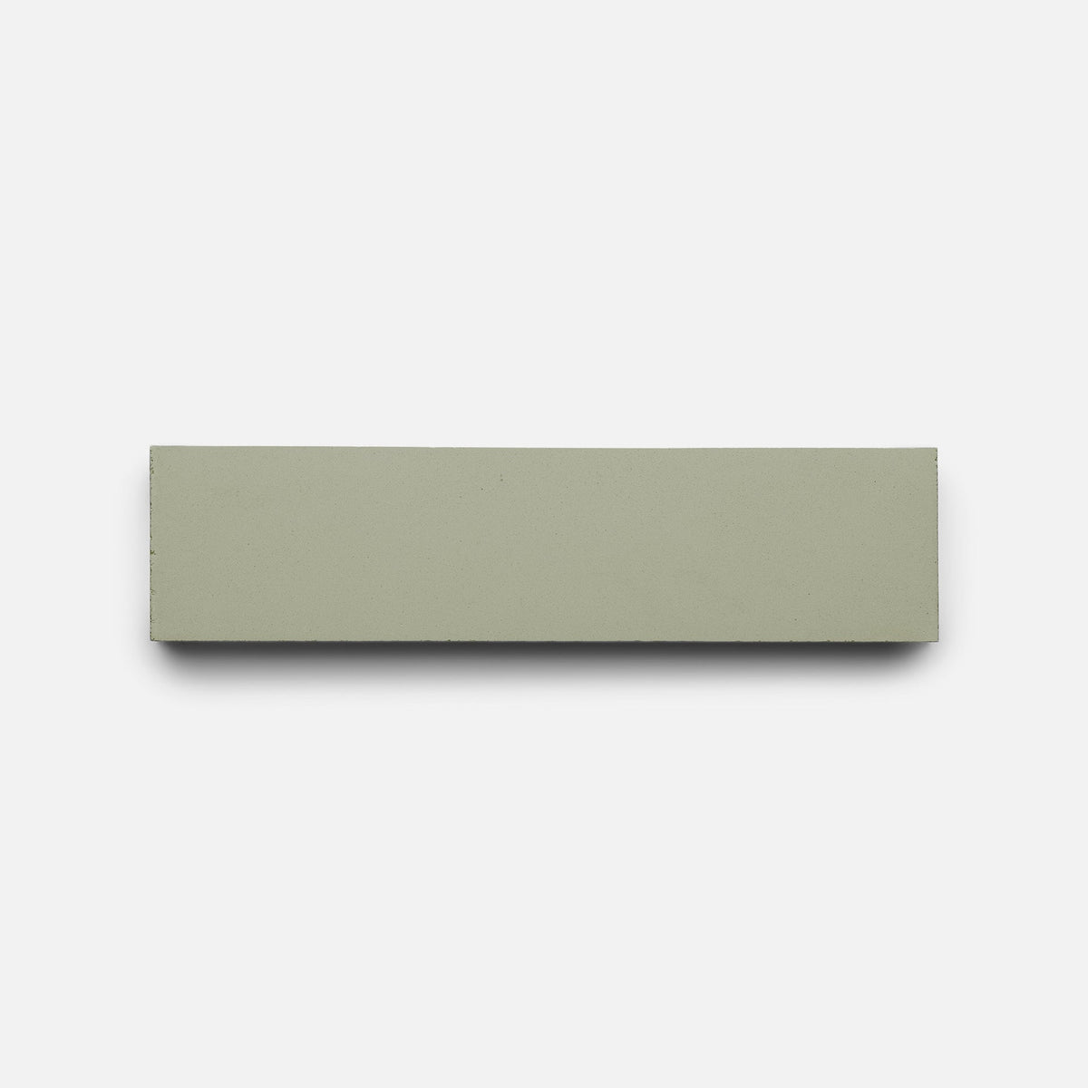 A Gypsum 2x8 tile sample by Zia Tile, light grayish-green and rectangular, is centered on a plain white background.