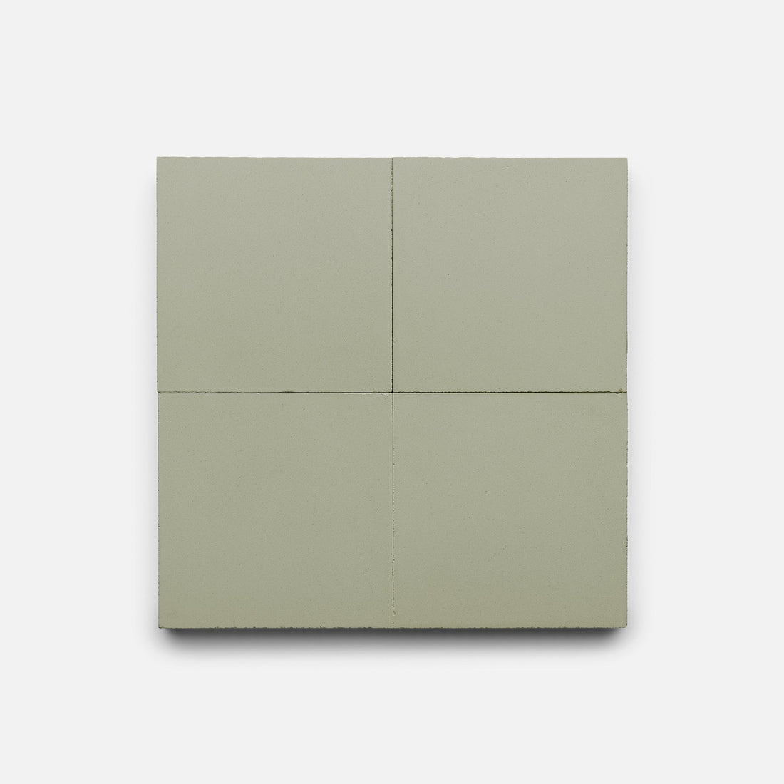 A square arrangement of four Zia Tile Gypsum 4x4 samples, light gray handmade tiles, evenly spaced with visible grout lines, set against a plain white background.