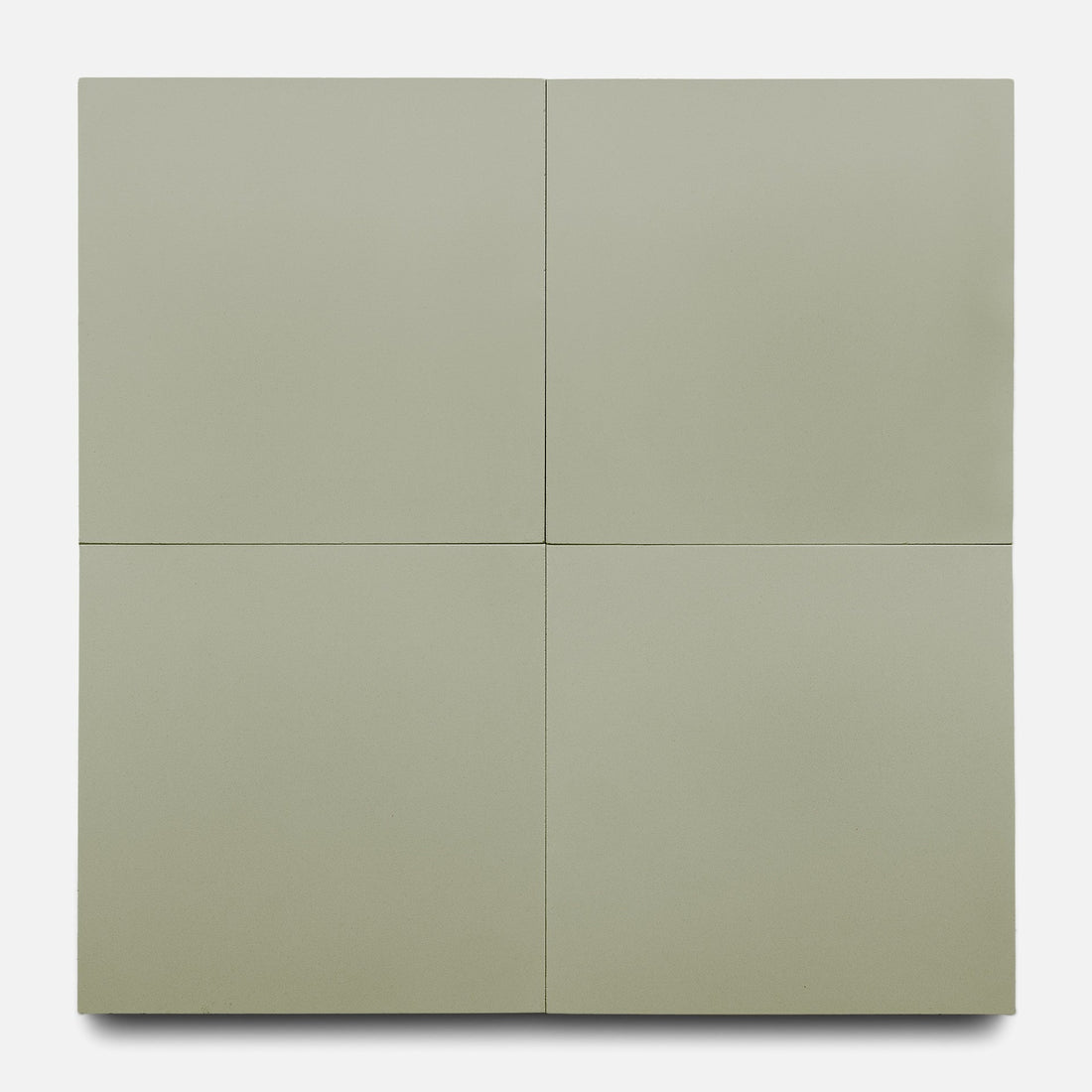 Gypsum 8x8 by Zia Tile features a smooth, flat surface in pale olive green, divided into four equal sections by thin intersecting lines. Its refined simplicity and handmade tile style echo the signature Zia Tile aesthetic.
