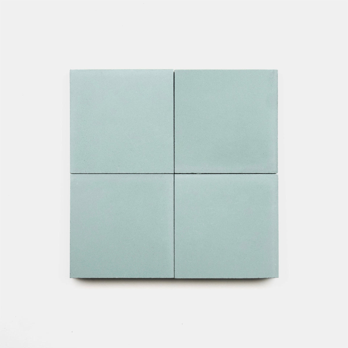 Four square, light blue Hailstone 4x4 cement tiles by vendor-unknown arranged in a 2x2 grid on a white background.