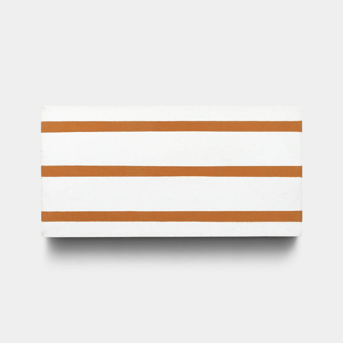 The Zia Tile High Line Ginger 4x8 Sample features four evenly spaced, horizontal terracotta stripes across a white surface, set against a light gray background that highlights its artisanal craftsmanship.