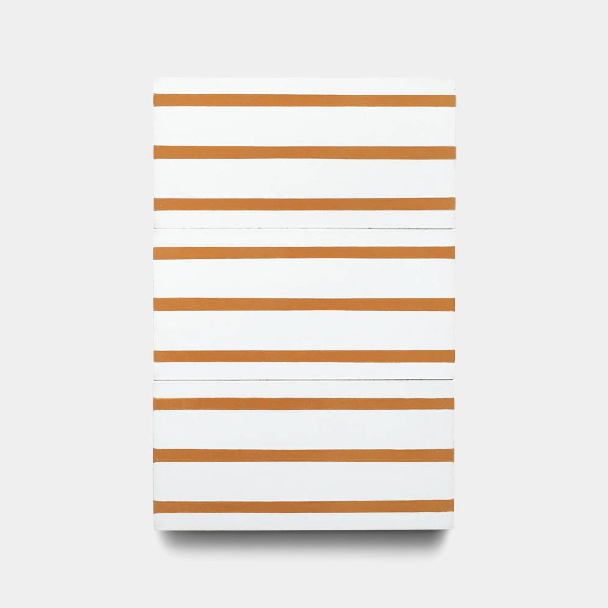 The High Line Ginger 4x8 sample by Zia Tile is a rectangular handmade tile with a white surface and evenly spaced horizontal orange stripes, echoing Zia Tile’s signature style.