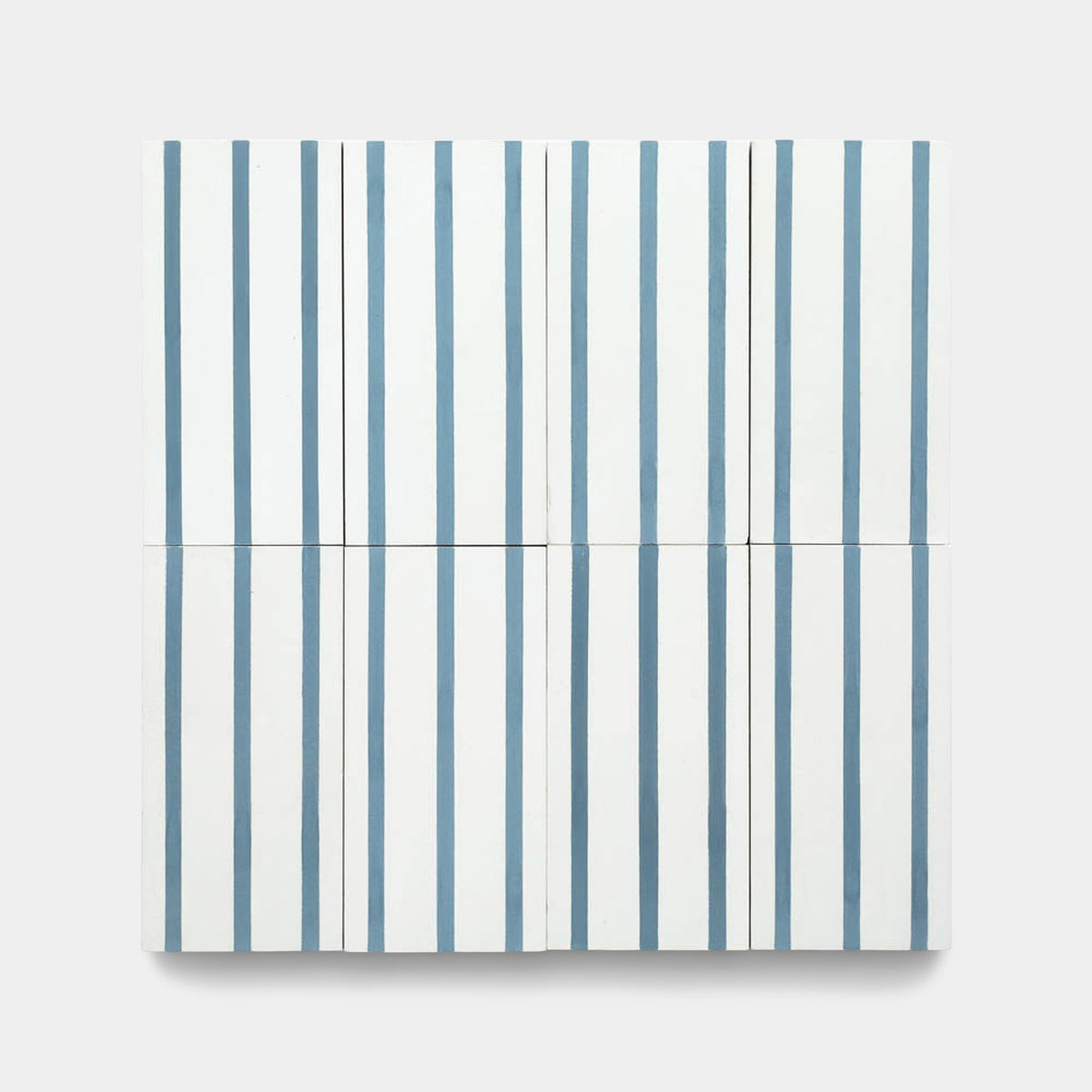A minimalist artwork inspired by Zia Tile’s High Line Hyannis 4x8 sample, featuring four square panels with evenly spaced vertical blue-grey stripes on a white background, echoing the brand’s clean geometric tile patterns.