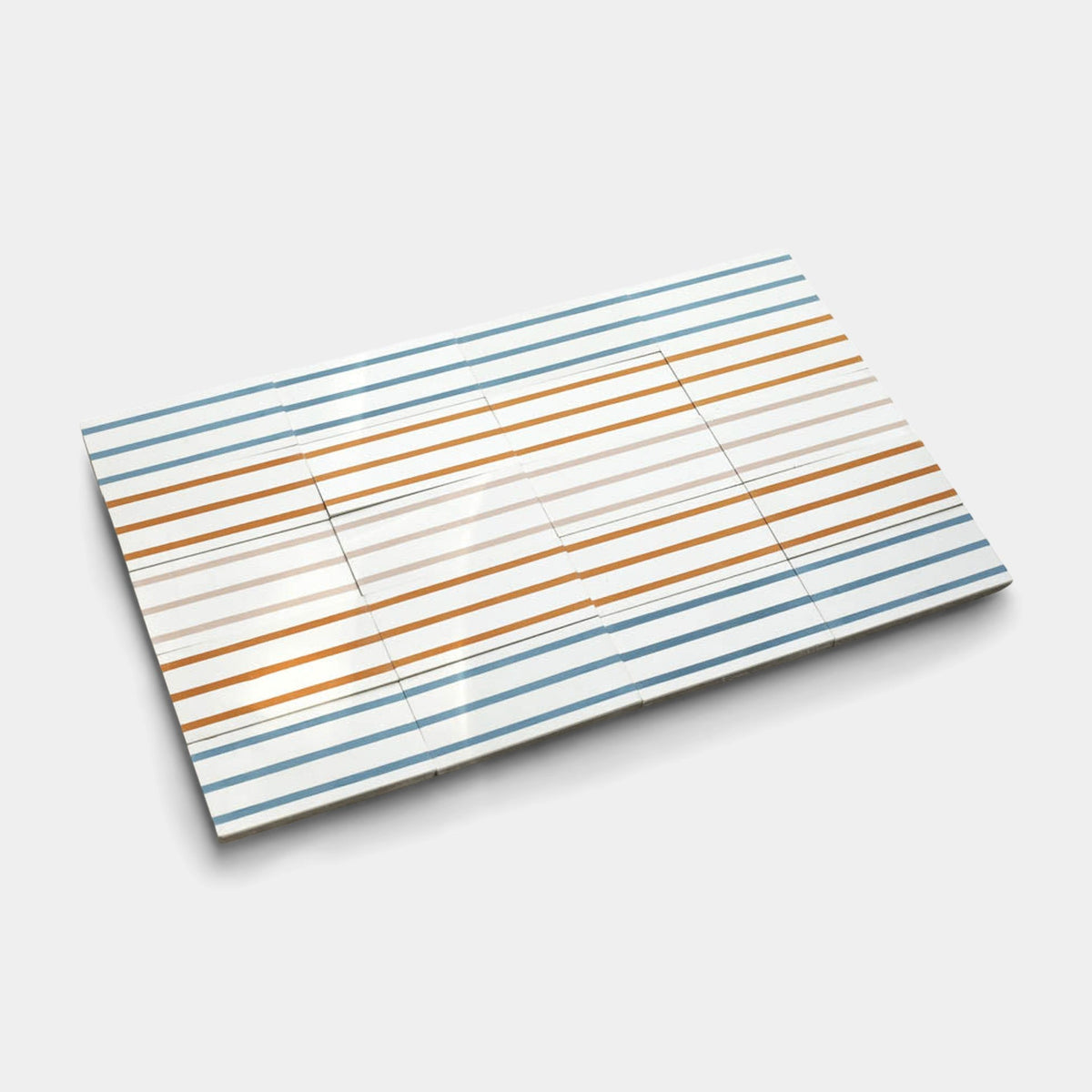 A rectangular handmade tile, the High Line Jaipur Pink 4x8 Sample by Zia Tile.