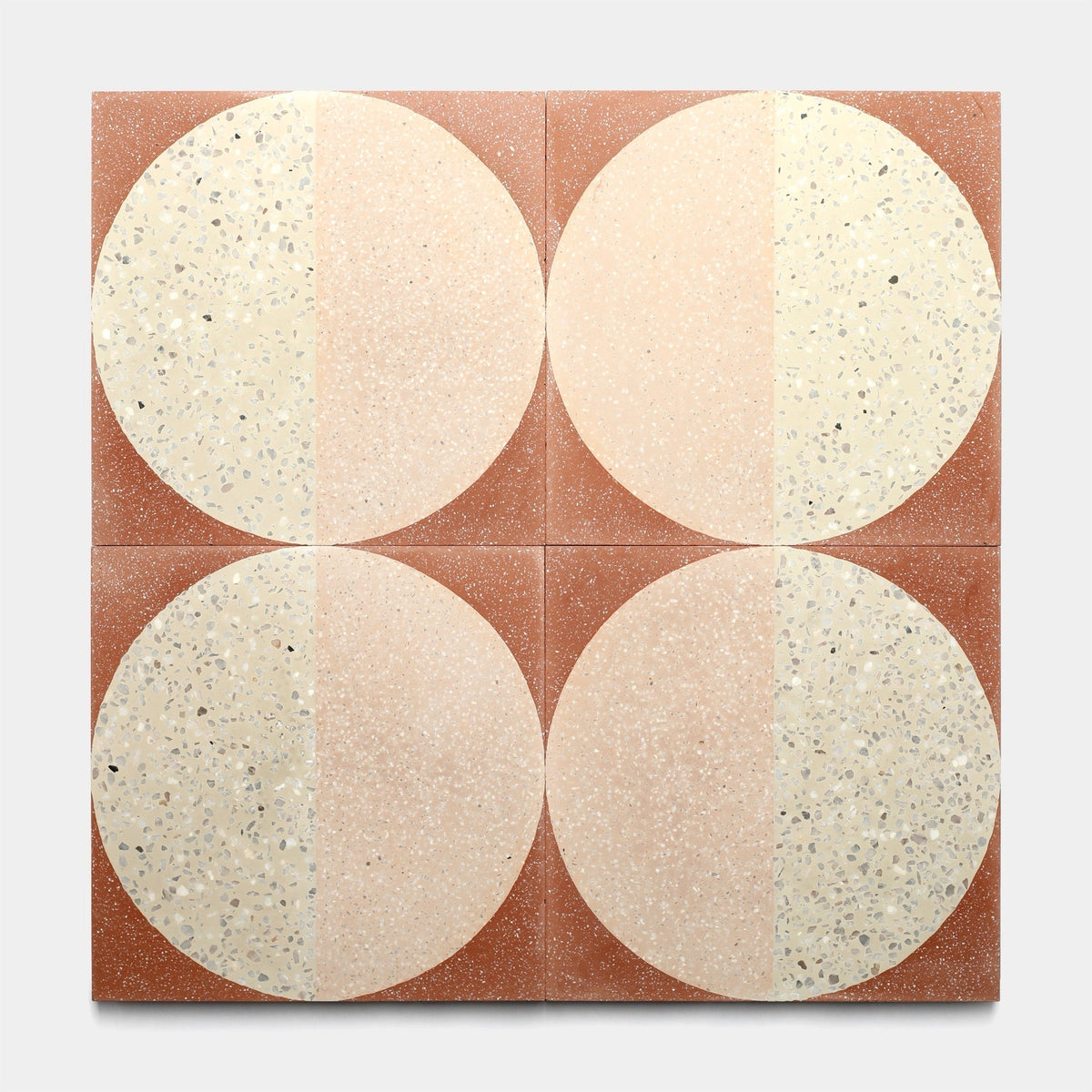 The Zia Tile Highball Jaipur Pink 12x12 sample is a handmade tile with circles and dots, ideal for adding a unique touch to any space.