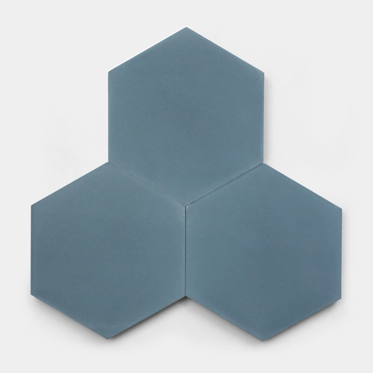 Three Hyannis Hex, Sample tiles from vendor-unknown are arranged with their sides touching, creating a larger geometric pattern on a plain white background.