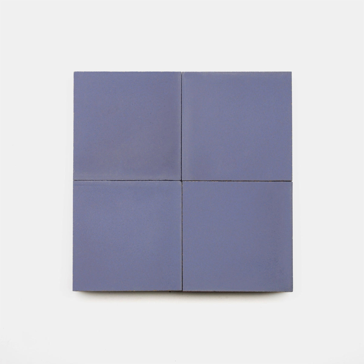 Four square Indigo 4x4, Sample tiles from vendor-unknown are arranged in a 2x2 grid on a plain white background.