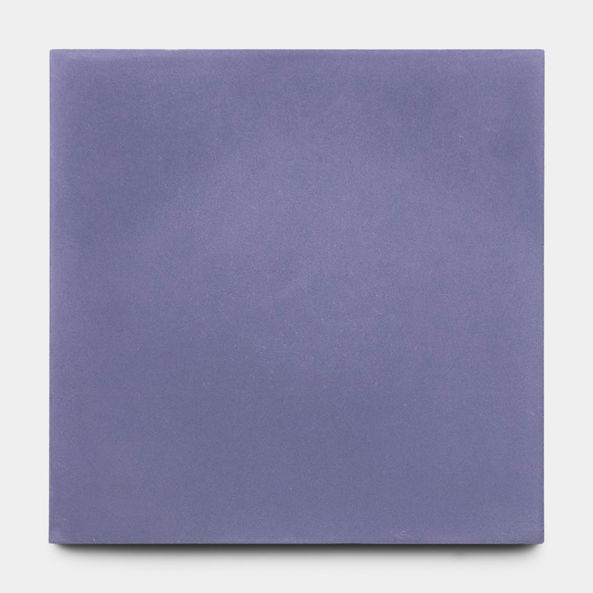 The Indigo 2x8 Sample by vendor-unknown is a matte cement tile in muted lavender, displayed on a plain light gray background.