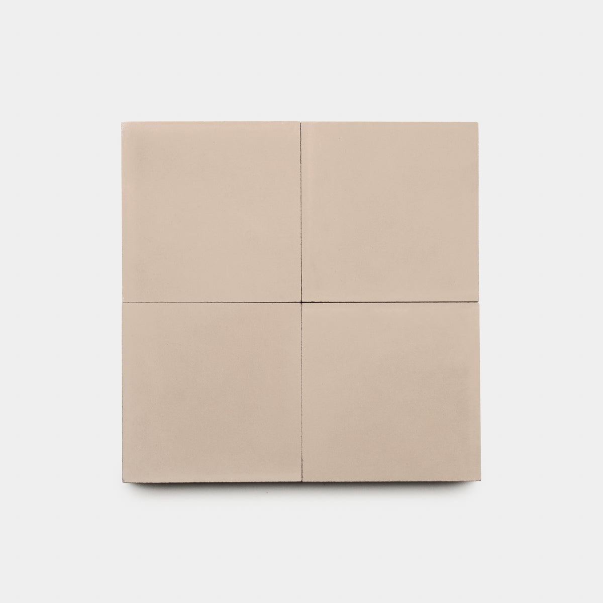 The Jaipur Pink 4x4 tile by vendor-unknown is a square beige cement tile divided into four equal sections with subtle grout lines, shown on a white background—ideal for adding elegance to your kitchen backsplash.