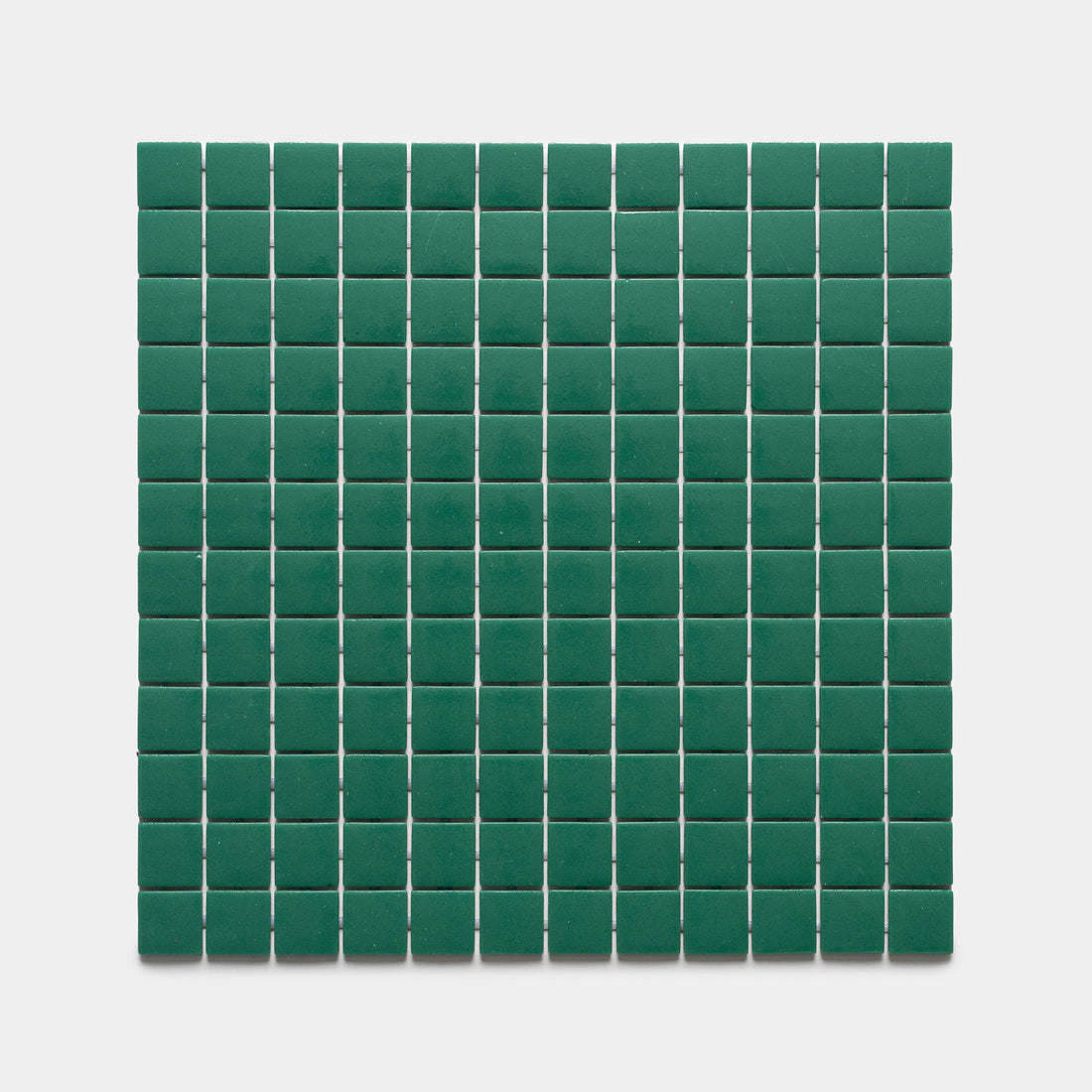 The Jasper 1x1 Sample by Zia Tile features a grid of small, square, green tiles arranged evenly on a white background.